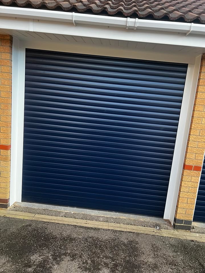 Navy blue garage door with white frame