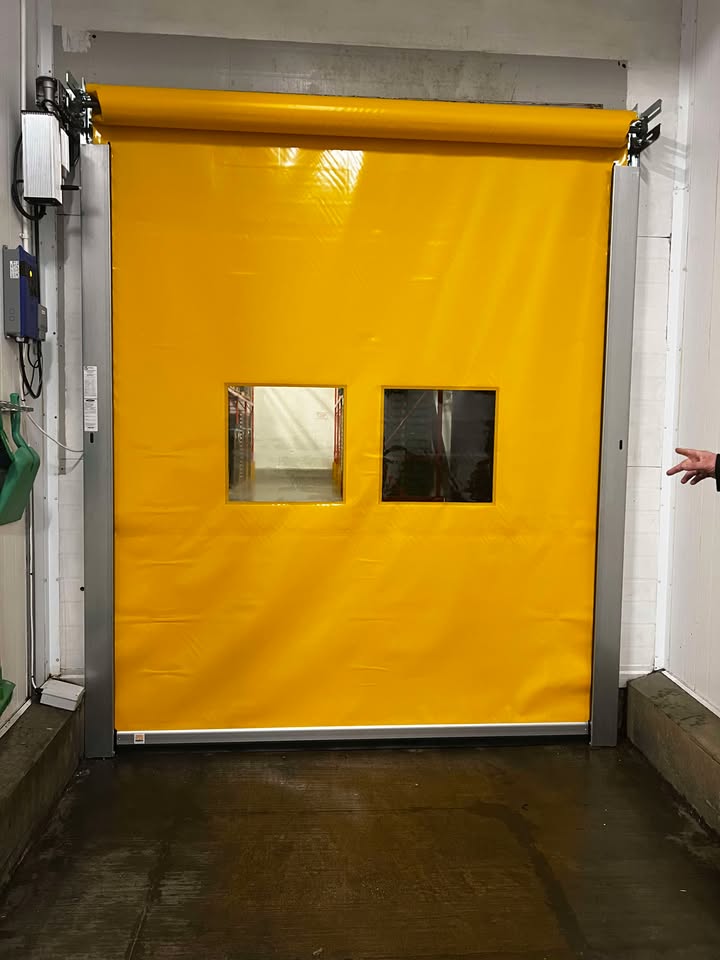 Yellow high-speed door with vision panels