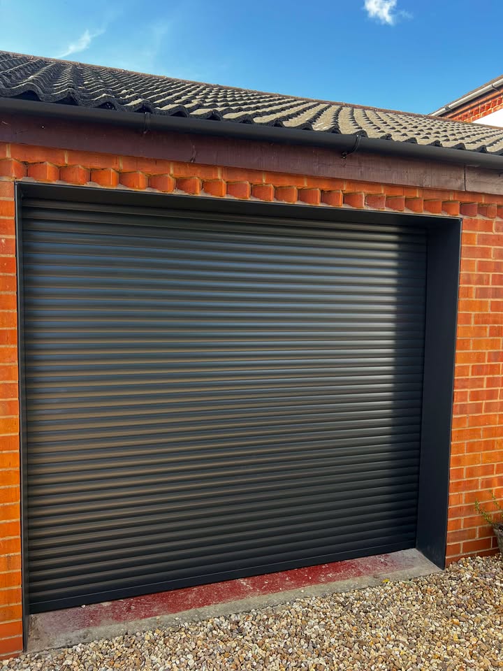 Roller garage door with brick surround